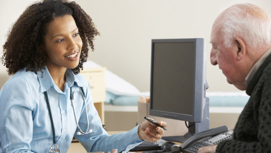 Young female Doctor with senior male patient