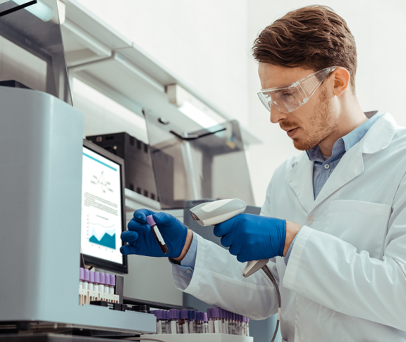 Smart bearded man holding a professional scanner