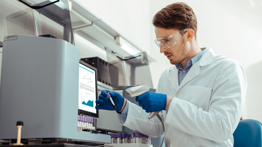 Smart bearded man holding a professional scanner