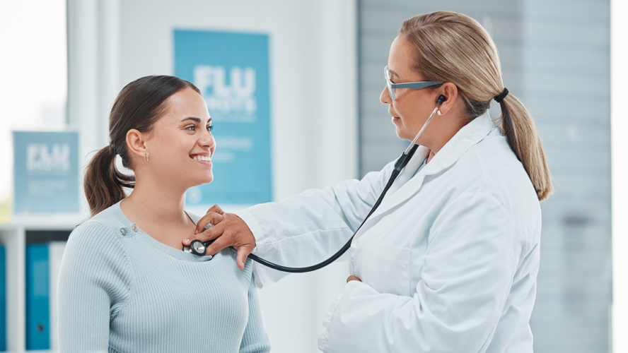 Shot of a doctor examining a patient with a stethoscope during a consultation in a clinic