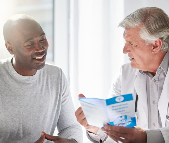 Shot of a mature doctor having a checkup with a patient at a hospital