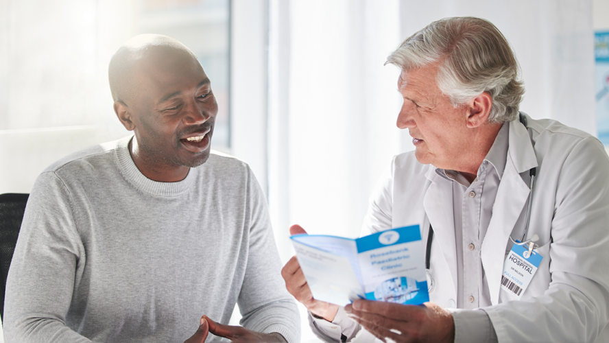 Shot of a mature doctor having a checkup with a patient at a hospital